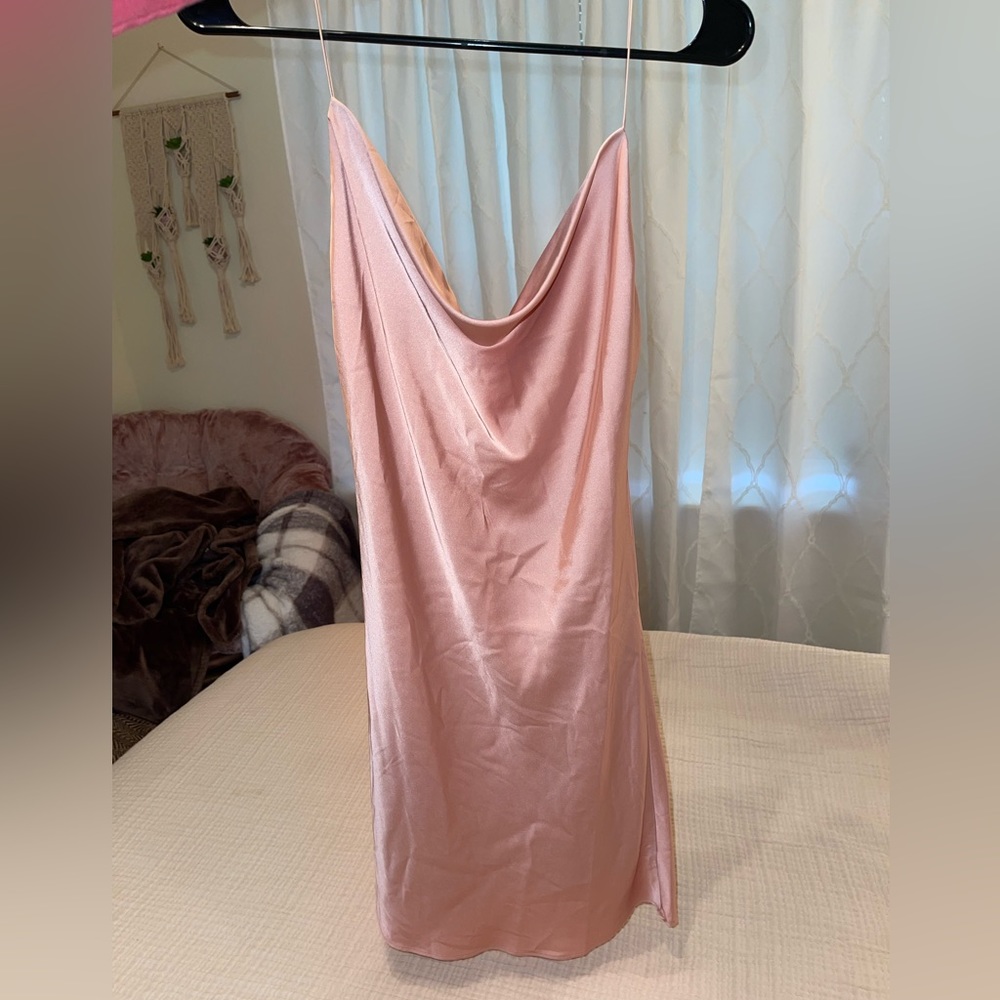 Baby pink silky mini dress. Backless with spaghetti straps.